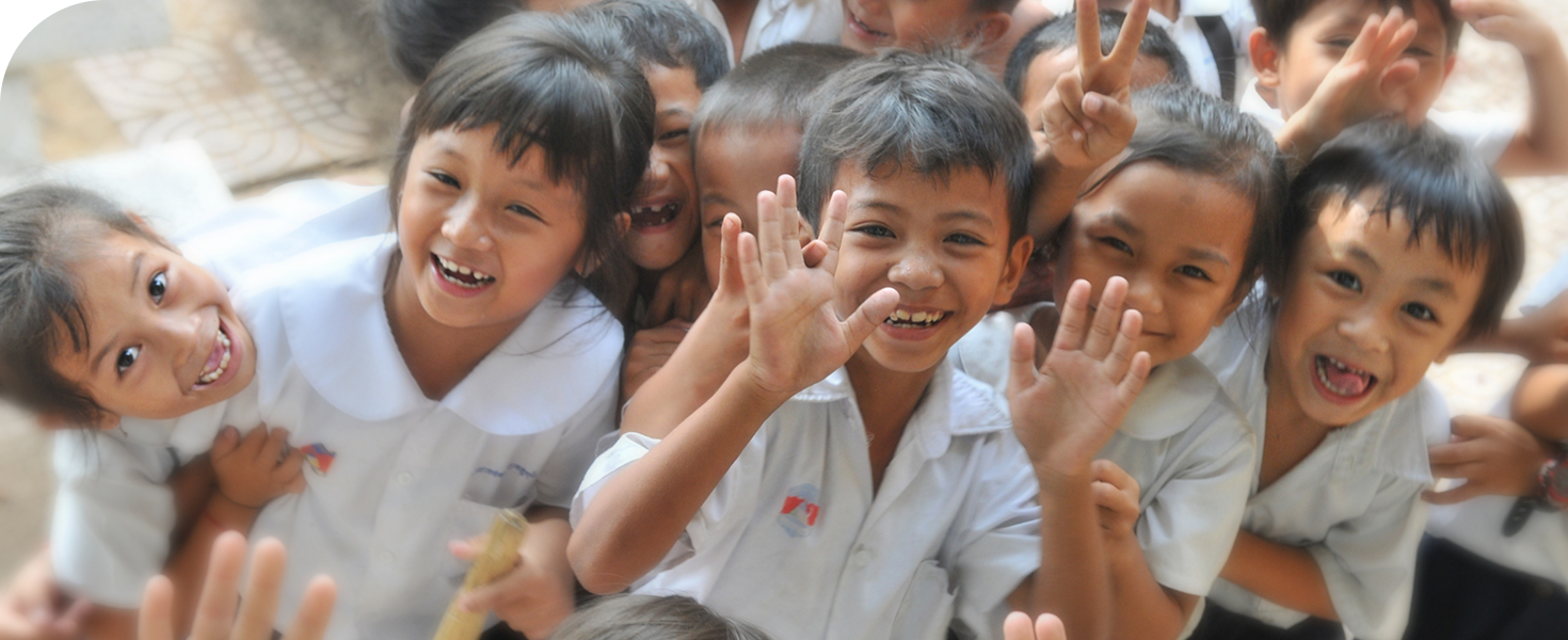 Kids smiling in a classroom