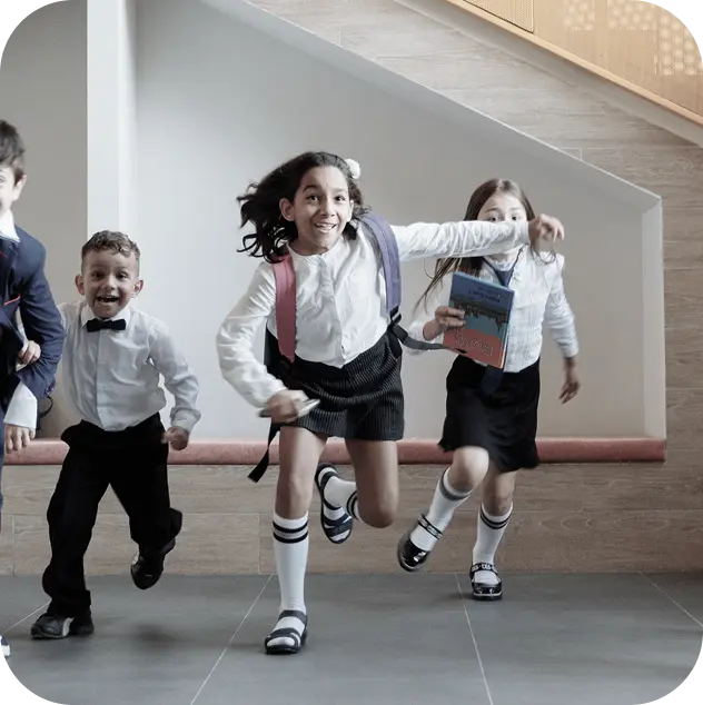 Kids running in a school corridor